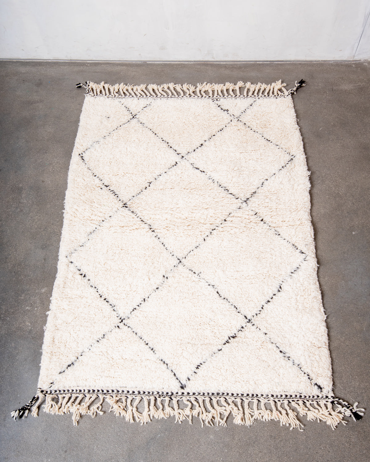 Modern, designer, handcrafted Berber rug from Morocco. Beniourain carpet with minimalist design, natural wool pile and a fluffy texture.